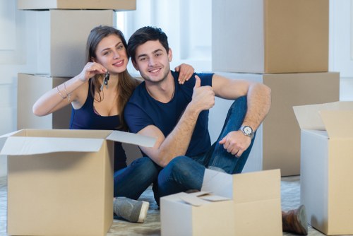 Furniture pick-up service removing a sofa from a Pinner home