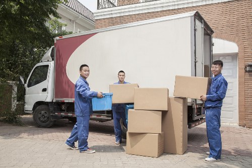 Professional house removals planning in Pinner with moving boxes and a removal van