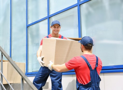 Man with van loading furniture in Pinner